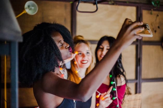 People taking selfies at event